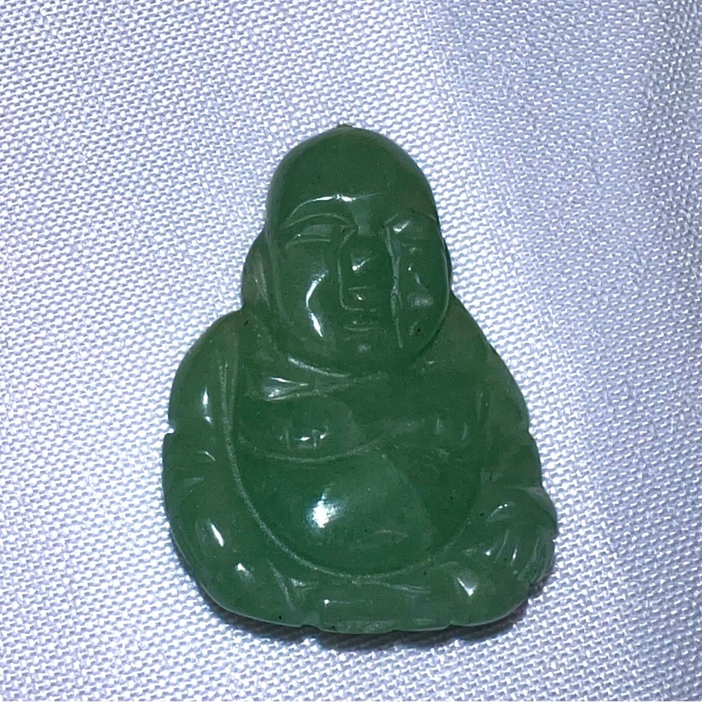 Pure jade pendant that is designed to be strung on a bracelet. I inch
